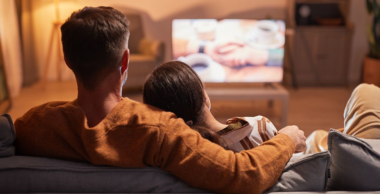 Two people watching TV